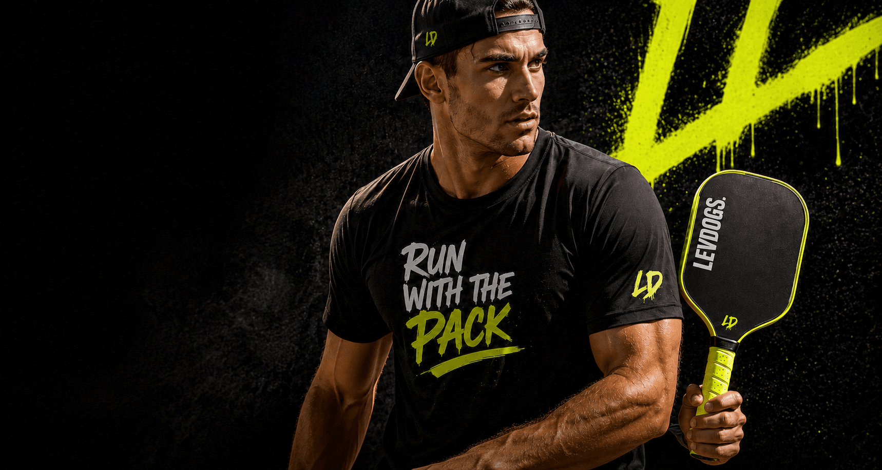 LEVDOGS athlete in a backwards cap holding the Alpha Pro competition pickleball paddle