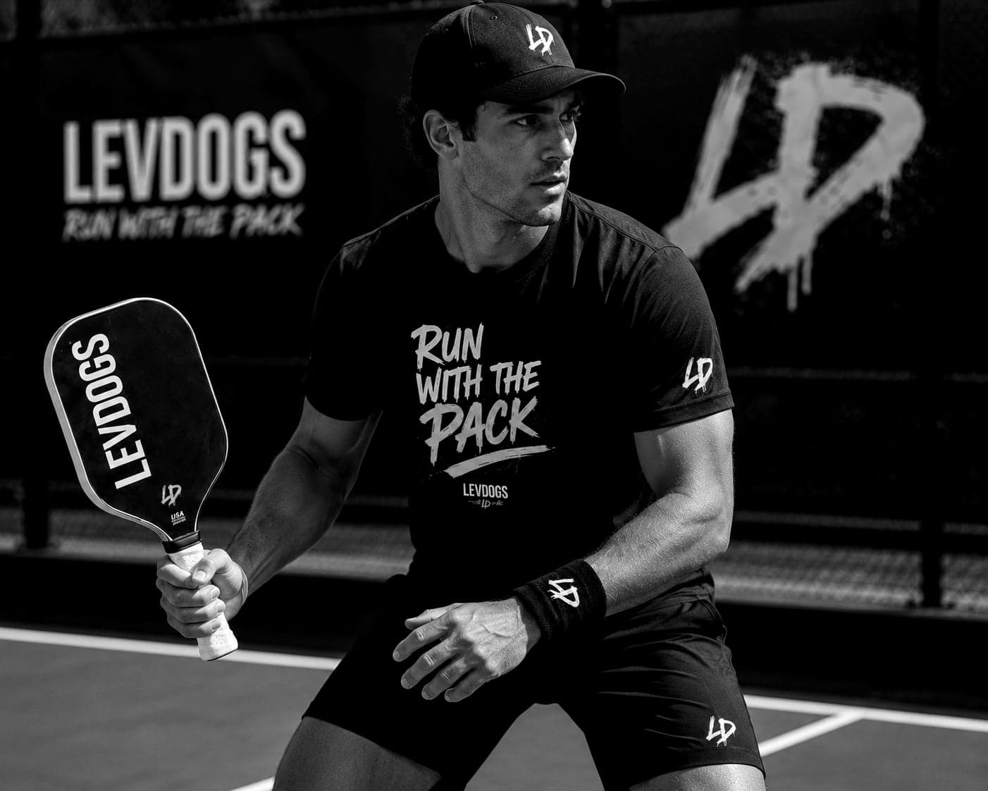 A LEVDOGS player in a ready stance on court